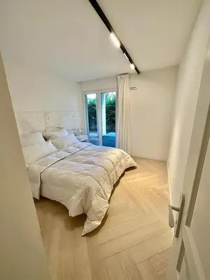 Un ou plusieurs lits dans un hébergement de l'établissement CAM0 - appartement 2 chambres en rez-de-terrasse