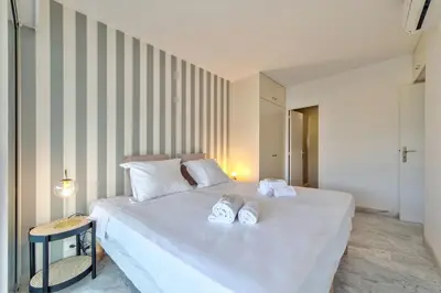 Un ou plusieurs lits dans un hébergement de l'établissement Appartement Canto bright appartement Croisette beach
