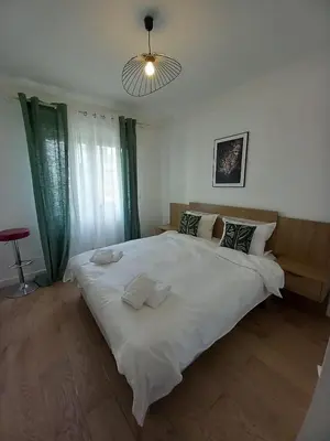 Un ou plusieurs lits dans un hébergement de l'établissement Cozy Home Center of Antibes