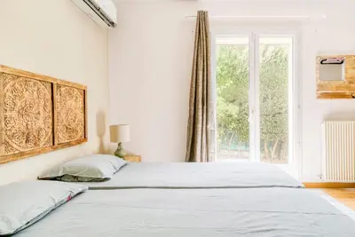 Un ou plusieurs lits dans un hébergement de l'établissement Villa Inti - piscine, jardin privé & barbecue