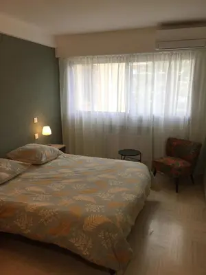 Un ou plusieurs lits dans un hébergement de l'établissement Appartement Mimosa Croisette