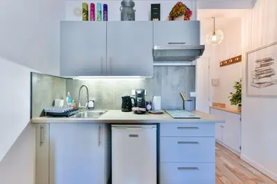 Cuisine ou kitchenette dans l'établissement LE FESTIF splendide studio avec loggia au Carré d'Or