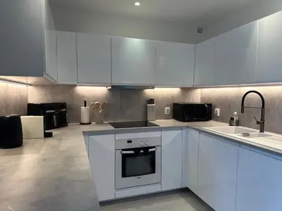 Cuisine ou kitchenette dans l'établissement Jolie maison familiale