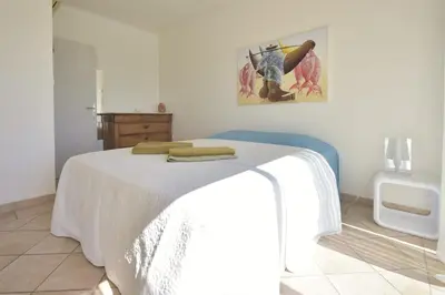 Un ou plusieurs lits dans un hébergement de l'établissement Family house with swimming pool & sea view