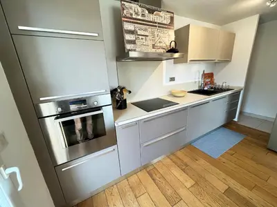 Cuisine ou kitchenette dans l'établissement Appartement 84m² avec 2 parkings privatifs