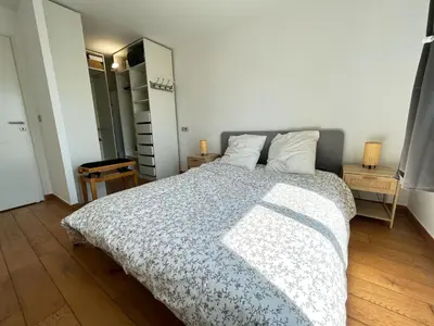 Un ou plusieurs lits dans un hébergement de l'établissement Appartement 84m² avec 2 parkings privatifs