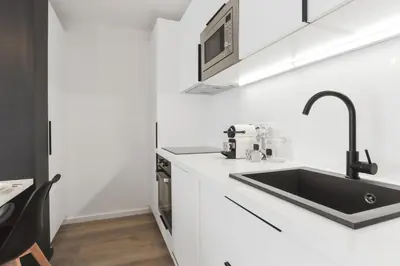 Cuisine ou kitchenette dans l'établissement Appartement Ebène - Welkey