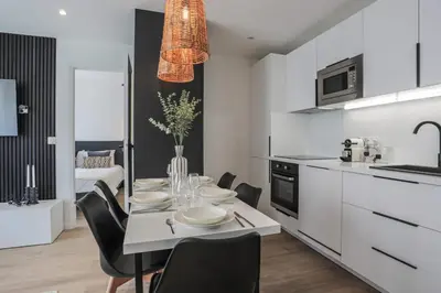 Cuisine ou kitchenette dans l'établissement Appartement Ebène - Welkey