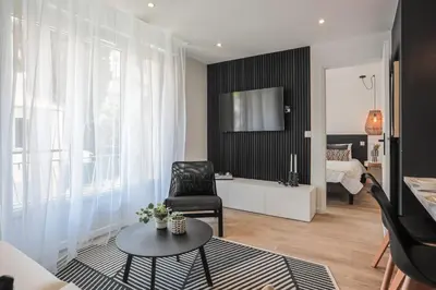 Télévision ou salle de divertissement dans l'établissement Appartement Ebène - Welkey