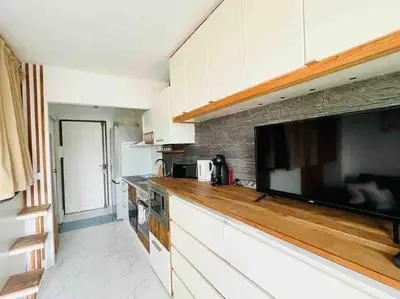 Cuisine ou kitchenette dans l'établissement Charmant studio pour 3 personnes