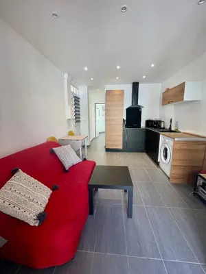 Cuisine ou kitchenette dans l'établissement Cosy appartement - Vieux port