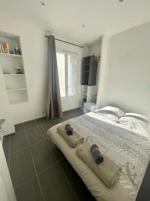 Un ou plusieurs lits dans un hébergement de l'établissement Cosy appartement - Vieux port