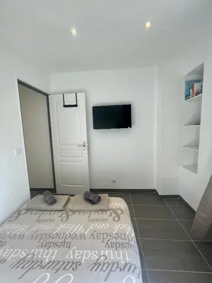Un ou plusieurs lits dans un hébergement de l'établissement Cosy appartement - Vieux port