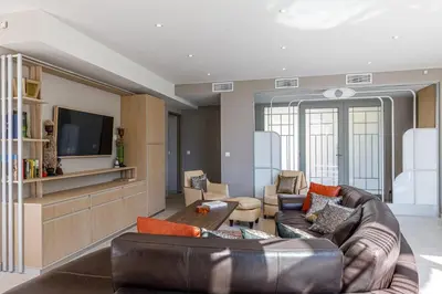 Télévision ou salle de divertissement dans l'établissement Luxueuse Villa Charleston - Vue mer, Sauna Hammam
