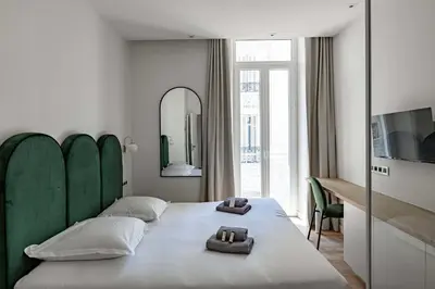 Un ou plusieurs lits dans un hébergement de l'établissement Superbe appartement 120m2 au coeur de Cannes