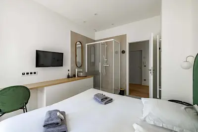 Un ou plusieurs lits dans un hébergement de l'établissement Superbe appartement 120m2 au coeur de Cannes