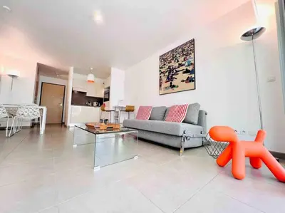 Coin salon dans l'établissement Le White Pearl : Apt 4 Prs, Parking, Clim
