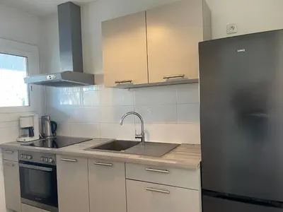Cuisine ou kitchenette dans l'établissement Le Chantilly