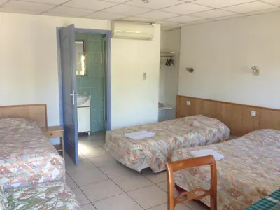 Un ou plusieurs lits dans un hébergement de l'établissement Hostellerie du loup
