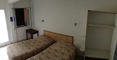 Un ou plusieurs lits dans un hébergement de l'établissement Hostellerie du loup
