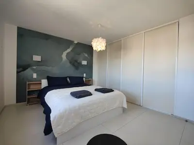 Un ou plusieurs lits dans un hébergement de l'établissement Cannes Vue mer T2 61m²+ parking