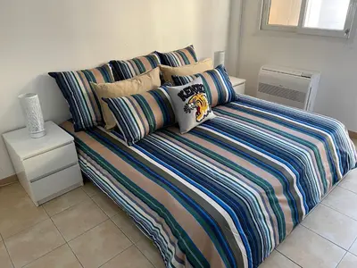 Un ou plusieurs lits dans un hébergement de l'établissement Villa climatisée piscine 3 chambres mer à 800m