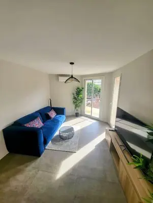 Coin salon dans l'établissement Appartement MARTINEZ 5 couchages