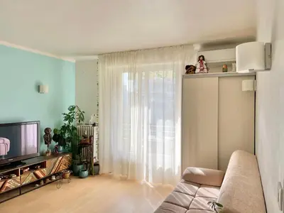 Télévision ou salle de divertissement dans l'établissement Palm Beach apartment