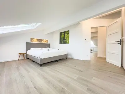 Un ou plusieurs lits dans un hébergement de l'établissement Le Duplex by Winsome Destination