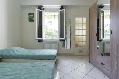 Un ou plusieurs lits dans un hébergement de l'établissement appartement RDC