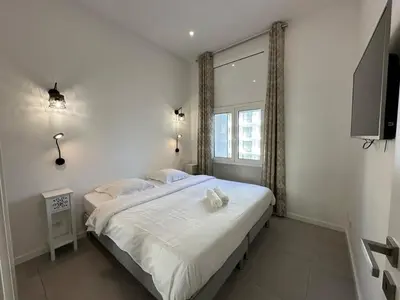 Un ou plusieurs lits dans un hébergement de l'établissement B080- À l'étroit à l'hôtel Bienvenue chez nous
