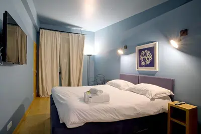Un ou plusieurs lits dans un hébergement de l'établissement Superbe appartement T5 proche du Palais et de la Croisette