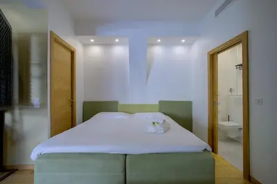 Un ou plusieurs lits dans un hébergement de l'établissement Superbe appartement T5 proche du Palais et de la Croisette