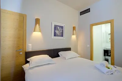 Un ou plusieurs lits dans un hébergement de l'établissement Superbe appartement T5 proche du Palais et de la Croisette