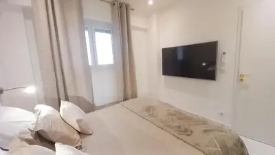 Télévision ou salle de divertissement dans l'établissement Le Palais Des Iles