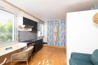 Télévision ou salle de divertissement dans l'établissement Mandara Beach Bungalow