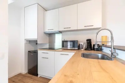 Cuisine ou kitchenette dans l'établissement Studio avec terrasse vue jardin