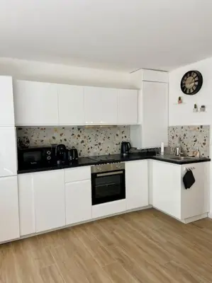 Cuisine ou kitchenette dans l'établissement Grands studio en bord de mer