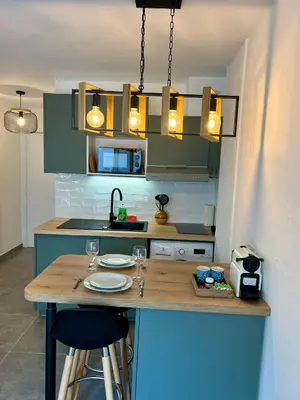 Cuisine ou kitchenette dans l'établissement Studio Climatisé, Cosy et Calme au Centre Ville