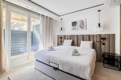 Un ou plusieurs lits dans un hébergement de l'établissement Luxurious Apartment- Croisette-Carré d'Or