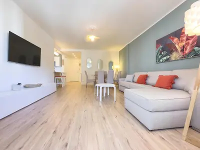 Télévision ou salle de divertissement dans l'établissement Le Palm by Winsome Destination