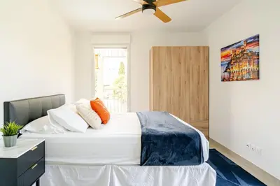 Un ou plusieurs lits dans un hébergement de l'établissement Newly Built Apartment with Pool, Walk to the Beach