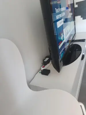Télévision ou salle de divertissement dans l'établissement Studio rdj 24 m2 et piscine