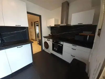 Cuisine ou kitchenette dans l'établissement Bel appartement à côté des plages 2 à 5 Personnes