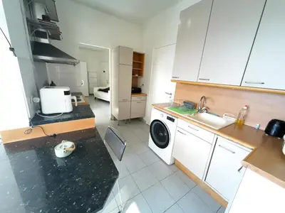 Cuisine ou kitchenette dans l'établissement Palais Porte de France Apartment With Air conditionner