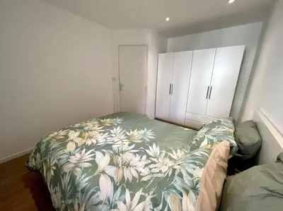 Un ou plusieurs lits dans un hébergement de l'établissement Superbe appartement 2P climatisé - Plages à pieds