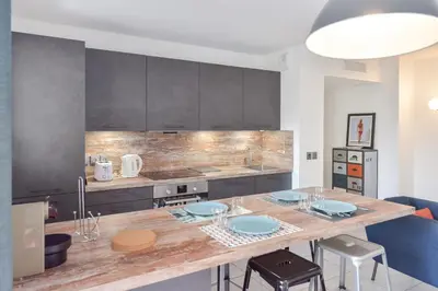 Coin salon dans l'établissement Modern apartment with swimming pool
