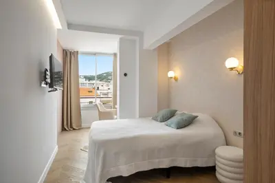 Un ou plusieurs lits dans un hébergement de l'établissement Luxury Romantic Cannes 45 Croisette Two Bedrooms