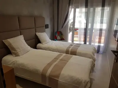 Un ou plusieurs lits dans un hébergement de l'établissement Cannes appartement 3 chambres - 8D
