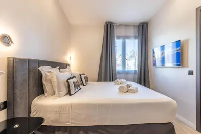 Un ou plusieurs lits dans un hébergement de l'établissement Bliss Triplex - Hyper Centre - Sauna - BBQ - Jacuzzi - LRACANNES